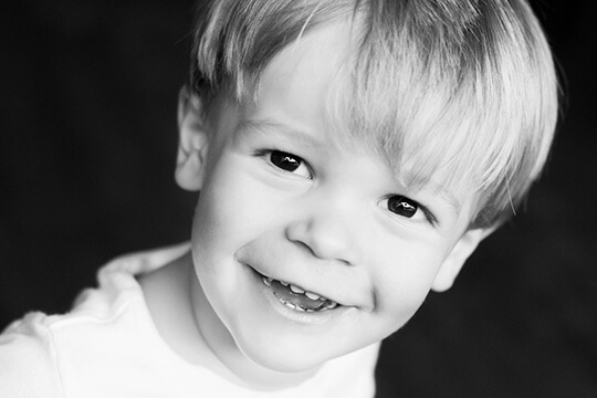 Smiling toddler boy with healthy teeth