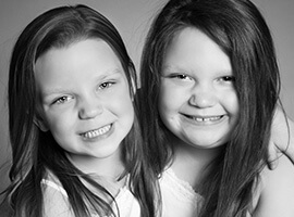 Two cute little girls smiling