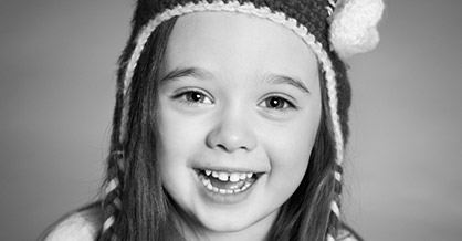 Smiling girl with knit hat
