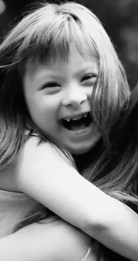 Young girl with special needs grinning