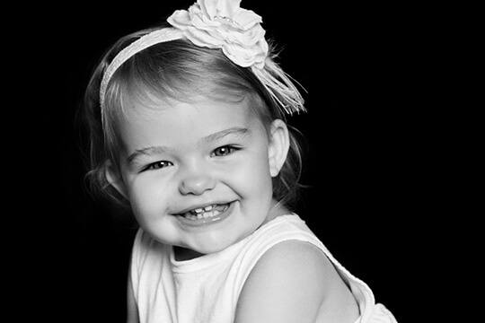 Smiling young girl with flower headband