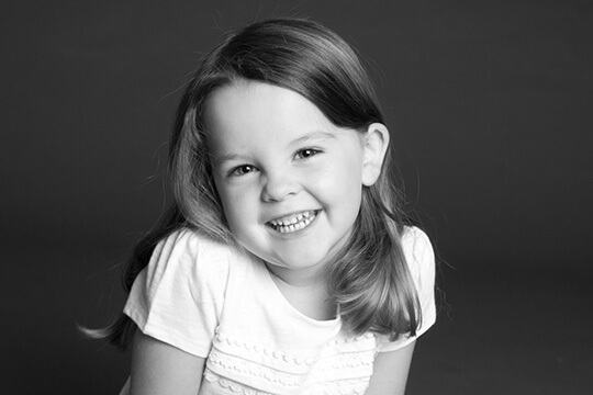 Laughing girl in white tee shirt