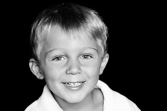Young boy in collared shirt