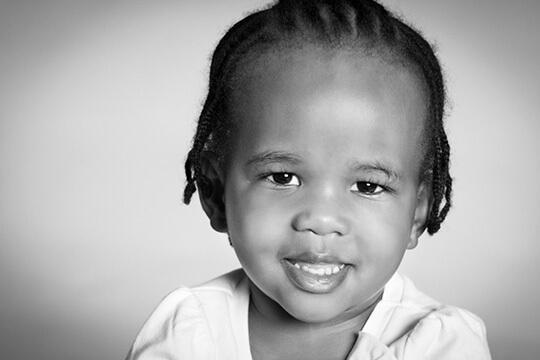 Young child smiling at camera
