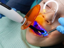 A young child undergoing restorative treatment for a cavity