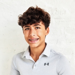 Smiling teenage girl with long brown hair
