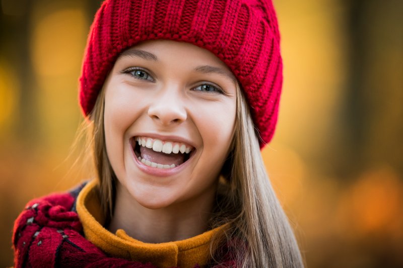 a young girl with a healthy smile