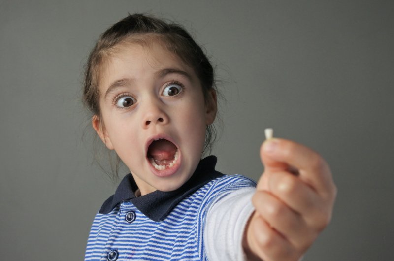 Girl with missing tooth