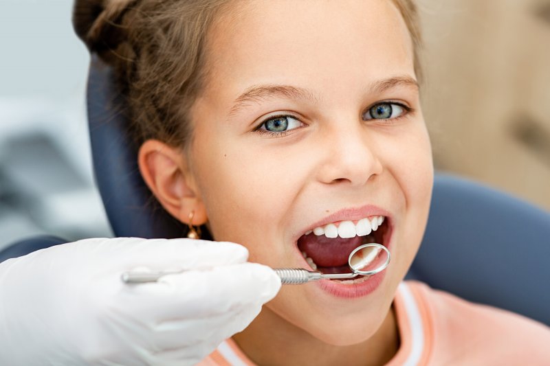 child smiling at dentist