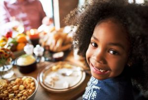 a child eating Thanksgiving dinner